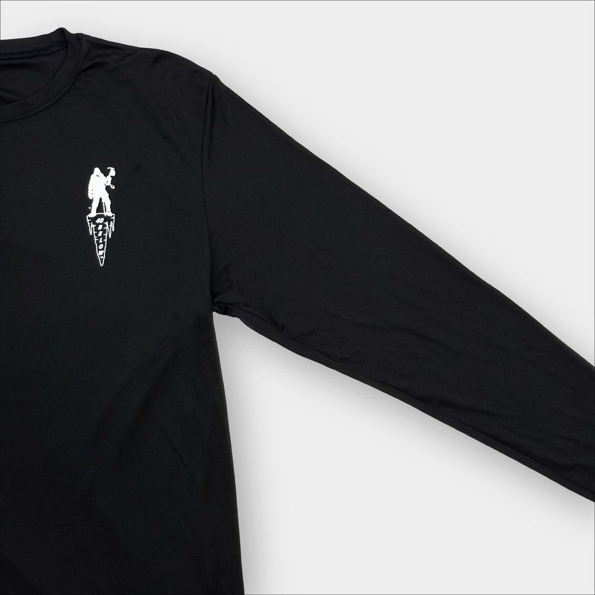 Forty Below athletic T-Shirt long sleeve black with white logo gray background