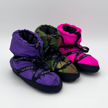 Forty Below Insulated Camp Bootie purple, camo, and pink colors next to eachother with black ribbon lacing on a white backdrop