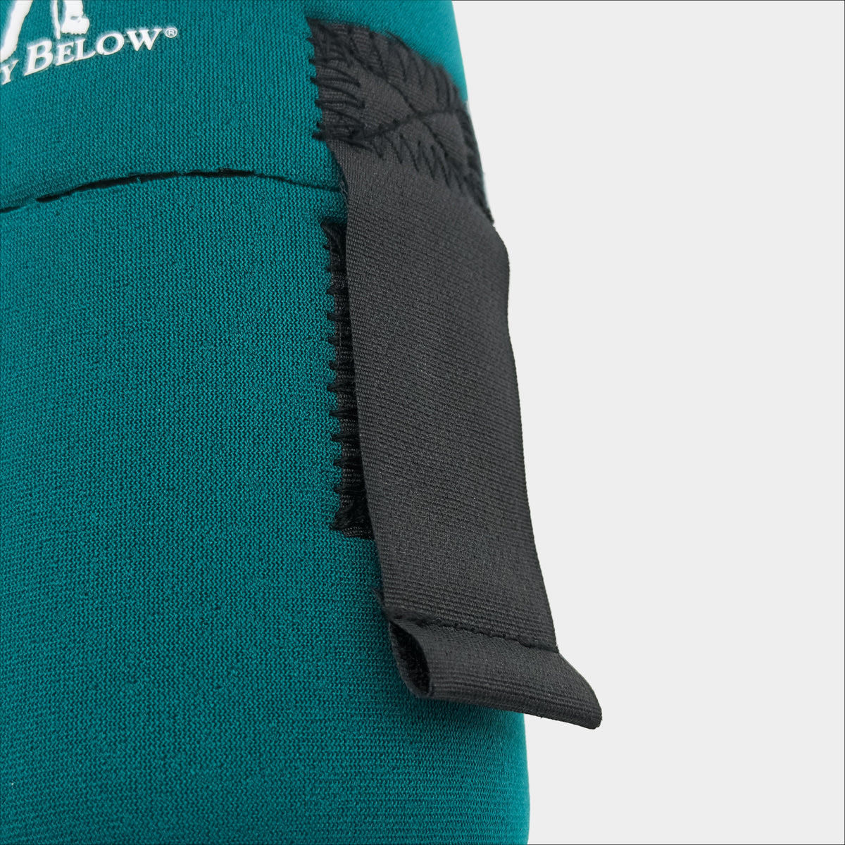 Forty Below 0.5 Liter Insulated Bottle Cover Green front close up view with white logo showing black velcro strap on a gray background