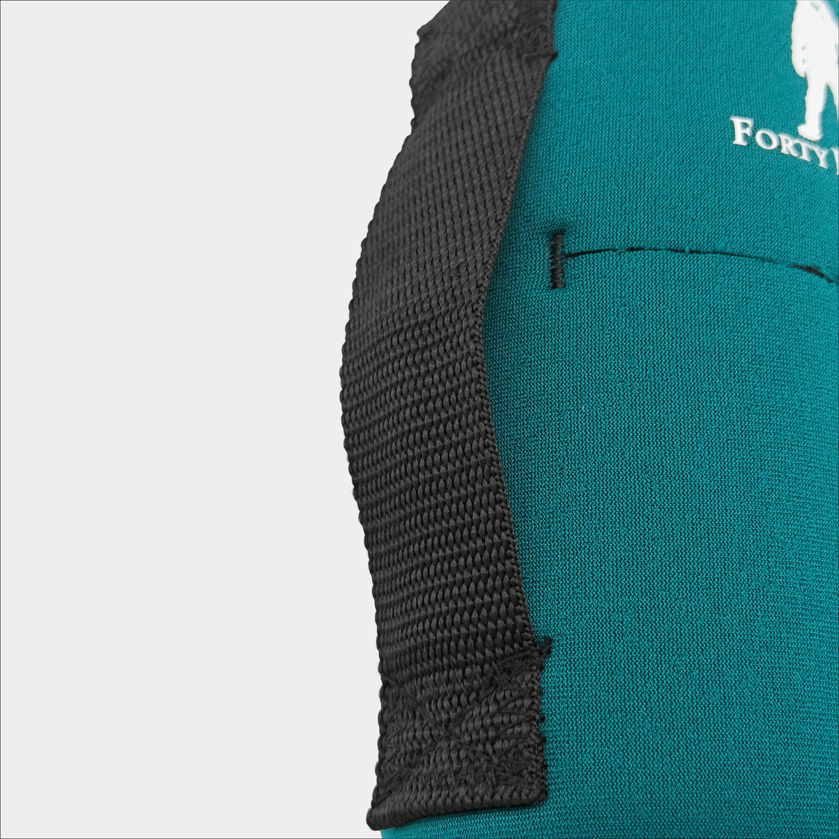 Forty Below 0.5 Liter Insulated Bottle Cover Green rear close up view with white logo showing black webbing belt loop on a gray background
