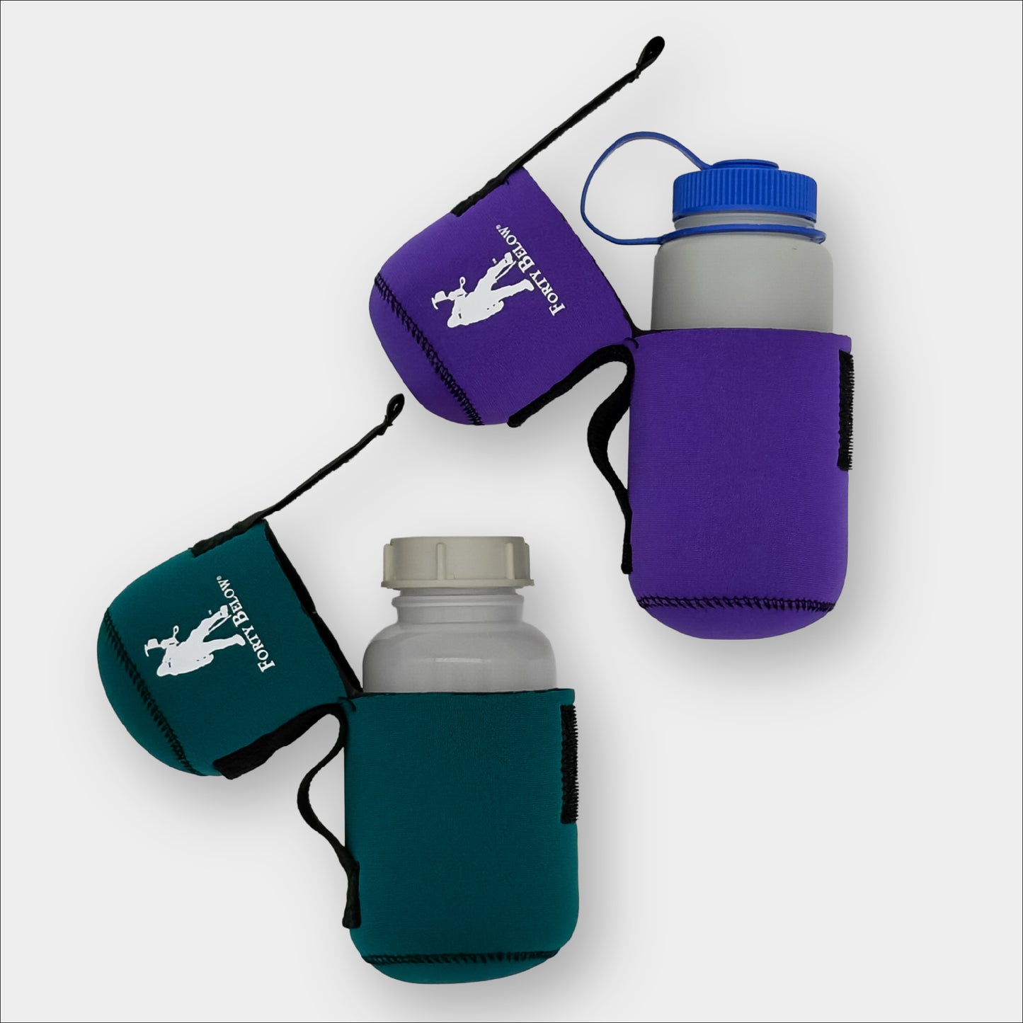 Two Forty Below 0.5 Liter Insulated Bottle Covers Green and Purple with their lids open showing nalgene and cold weather bottles inside of them on a gray background