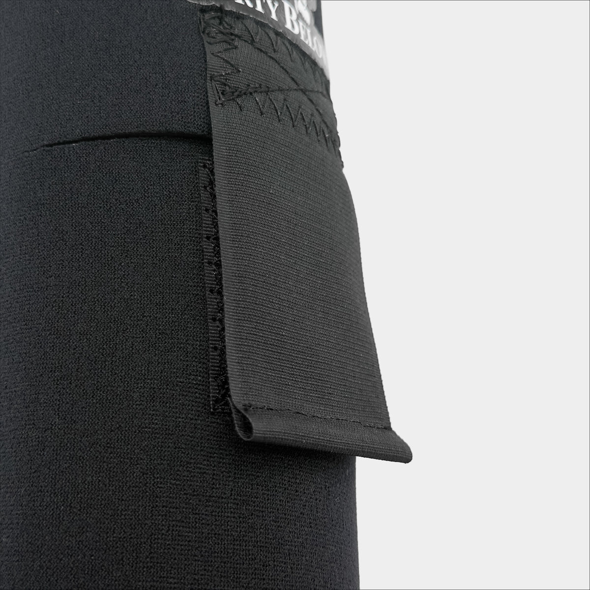 Forty Below 0.75 Liter Insulated Bottle Cover Black front view close up showing black velcro strap on a gray background