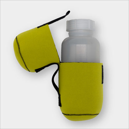Forty Below 1.5 Liter Insulated Bottle Cover Yellow with black belt loop side view partially open showing Forty Below Cold Weather Bottle inside with gray background