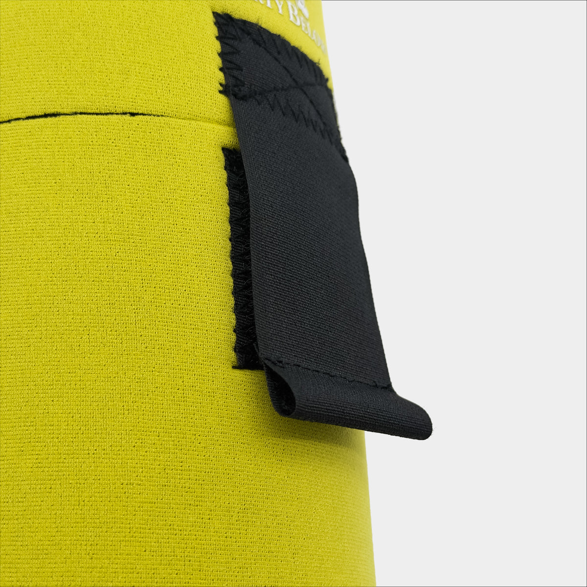 Forty Below 1.5 Liter Insulated Bottle Cover Yellow with velcro closure front  close up view showing closure on a gray background