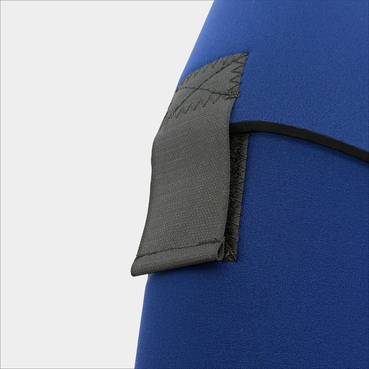 Forty Below 2qt Insulated Bottle Boot navy Blue close up rear view showing rear velcro strap on a gray background
