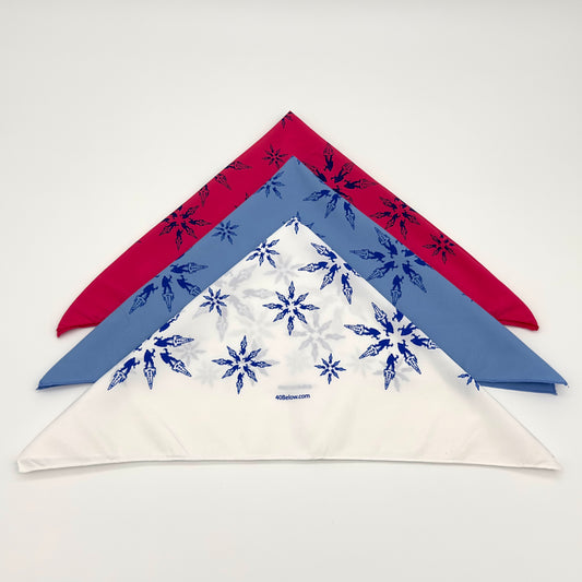 Forty Below synthetic Bandana in red, blue, and white folded into triangles on a white background