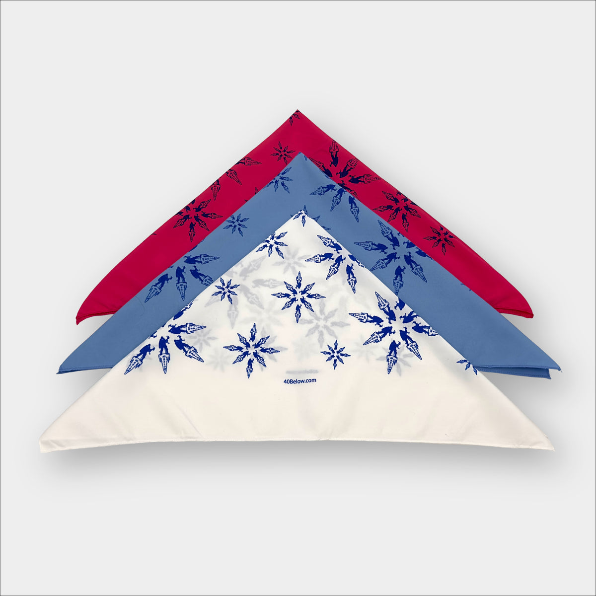 Forty Below synthetic Bandana in red, blue, and white folded into triangles on a white background