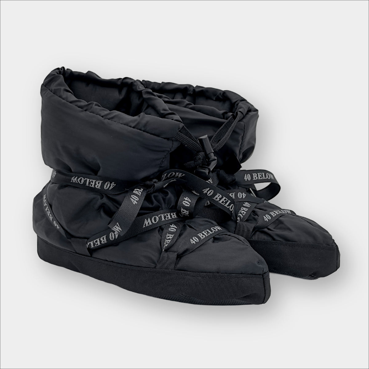 Forty Below Insulated Camp Bootie Side Thumbnail black with black ribbon lacing on a grey background