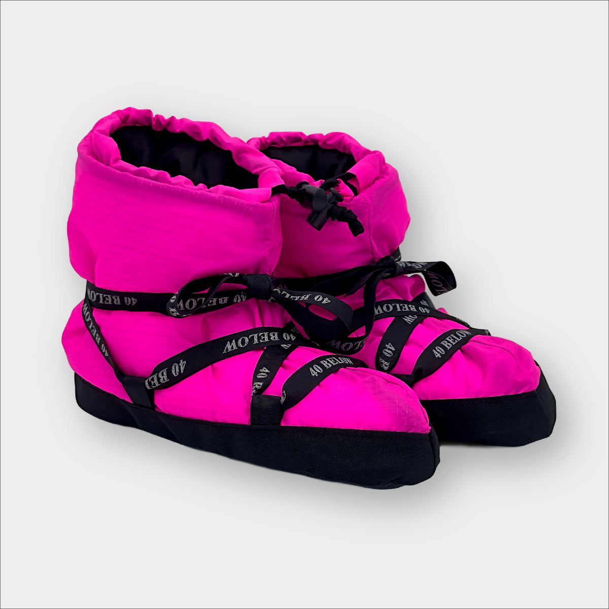 Forty Below Insulated Camp Bootie Side Thumbnail neon pink with black ribbon lacing on a grey background