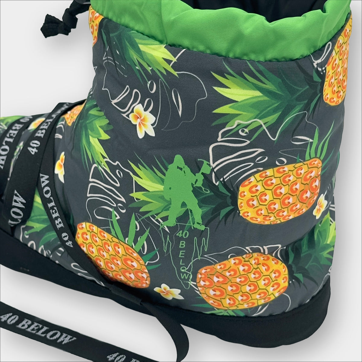 forty below insulated camp bootie pineapple green pattern rear side view showing pattern graphic with black lacing on a grey background