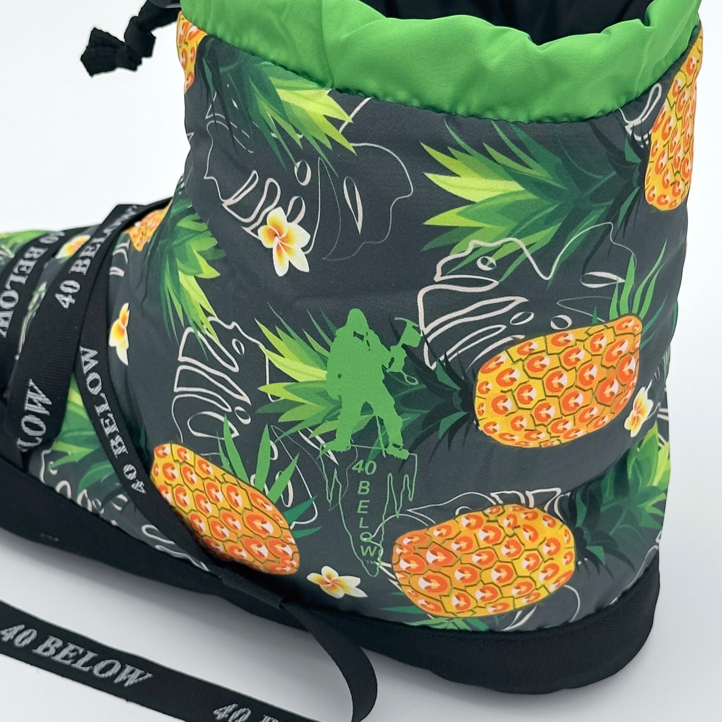 forty below insulated camp bootie pineapple green pattern rear side view showing pattern graphic with black lacing on a white background