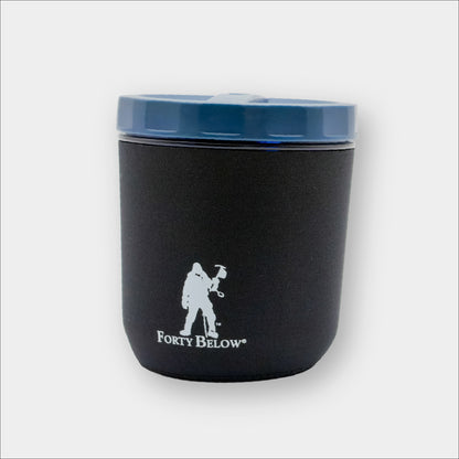 Insulated Forty Below mug boot Black with white logo on a the GSI Fairshare Mug on a gray background
