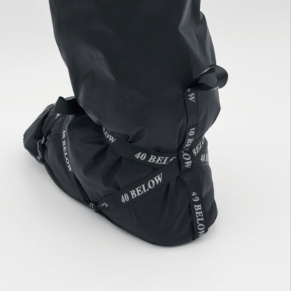 Forty Below Camp Bootie Overbootie cover rear view showing heel and black and white lacing  with white background