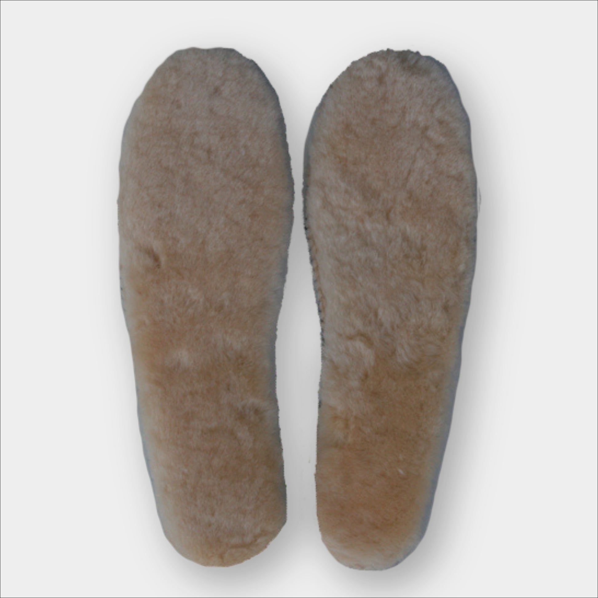 Forty Below Sheepskin Insoles top down soft fluffy tan top on a plain grey background