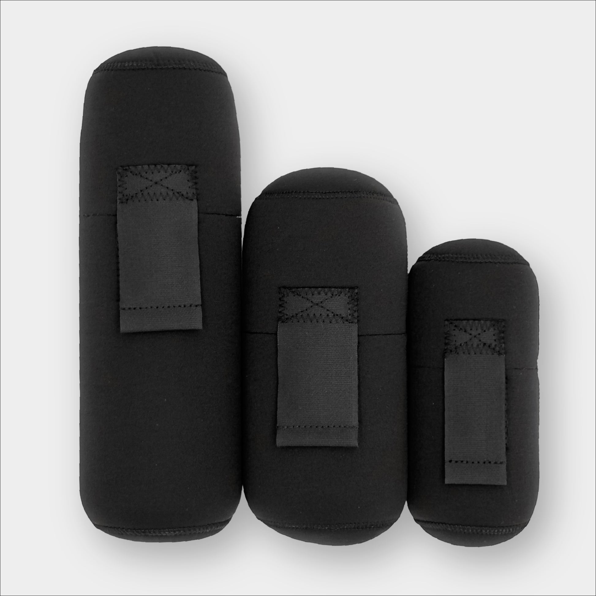 Forty Below Insulated Bottle Boot 48 oz, 1.0 Liter and 0.5 Liter black color all next to each other front facing with no logo on a gray background
