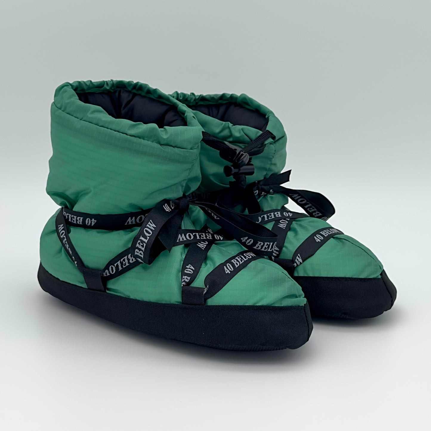 Forty Below  insulated camp bootie thumbnail green with black lacing on a white background